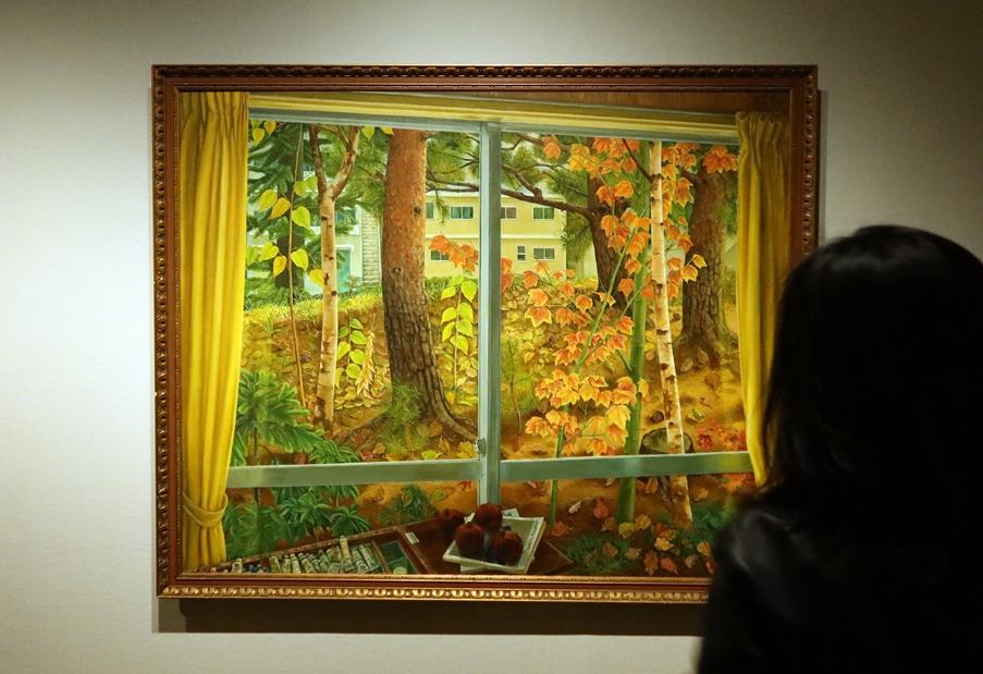 A visitor on April 16 looks at a work by Korean Japanese artist Kim Chongnam (Hideo Manabe) at a news conference for the exhibition 