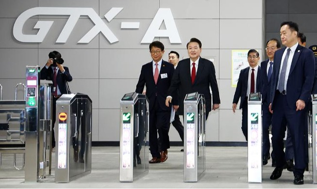 President Yoon goes on trial ride on new express subway line