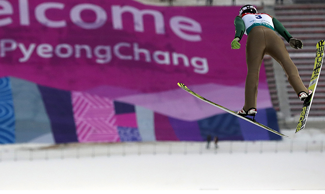 Olympians race through Pyeongchang snowfields