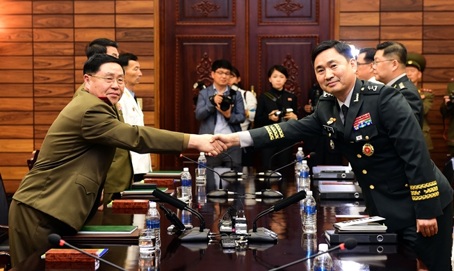 Two Koreas agree to restore military communication lines