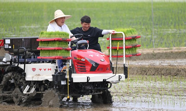 President Yoon plants rice with self-driving transplanter