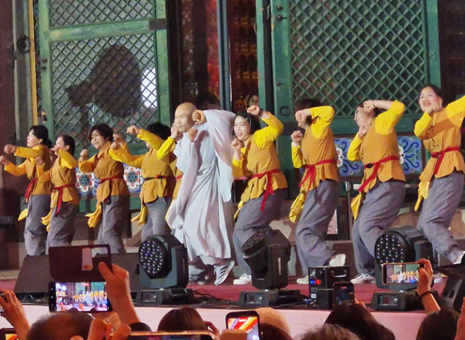 Annual Buddhist festival evolves via high youth participation, AI